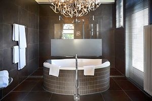 Half of bathroom with wood floors