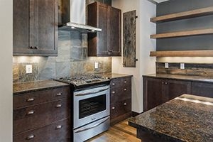 Kitchen with tile backsplash that looks like wood