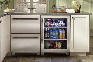 Kitchen with under counter appliance storage