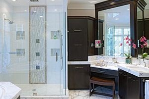 A bathroom with a desk in the bathroom