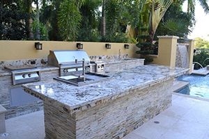 Outdoor kitchen with stone counters or regular counters