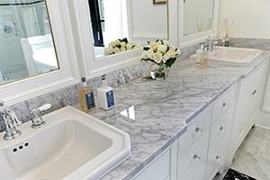 bathroom with marble counters