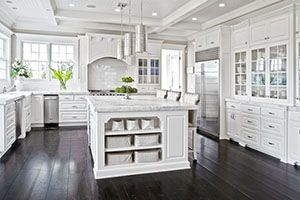 kitchen with white marble counters and cabinets