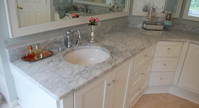 marble sink and countertop in bathroom