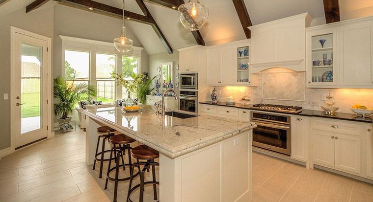 traditional kitchen with stone counters and floors