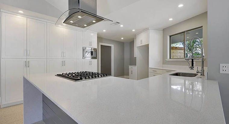 white quartz counters and gray island