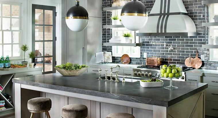 honed Pietra gray marble countertops in rustic kitchen