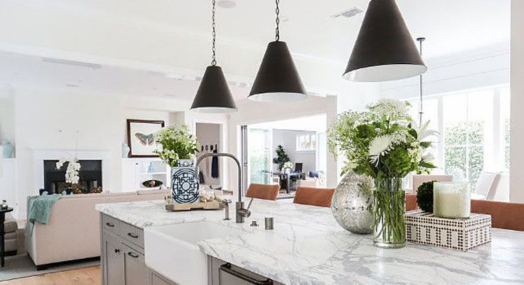 white marble countertops in no-frills kitchen