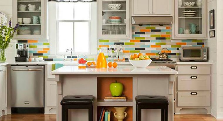 kitchen with colored subway tile backsplash